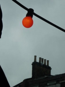 An orange light bulb on Brick Lane